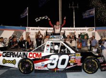 Todd Bodine, driver of the #30 Germain.com Toyota, celebrates after winning the NASCAR Camping World Truck Series Built Ford Tough 225 at Kentucky Speedway. Credit: Chris Graythen/Getty Images for NASCAR